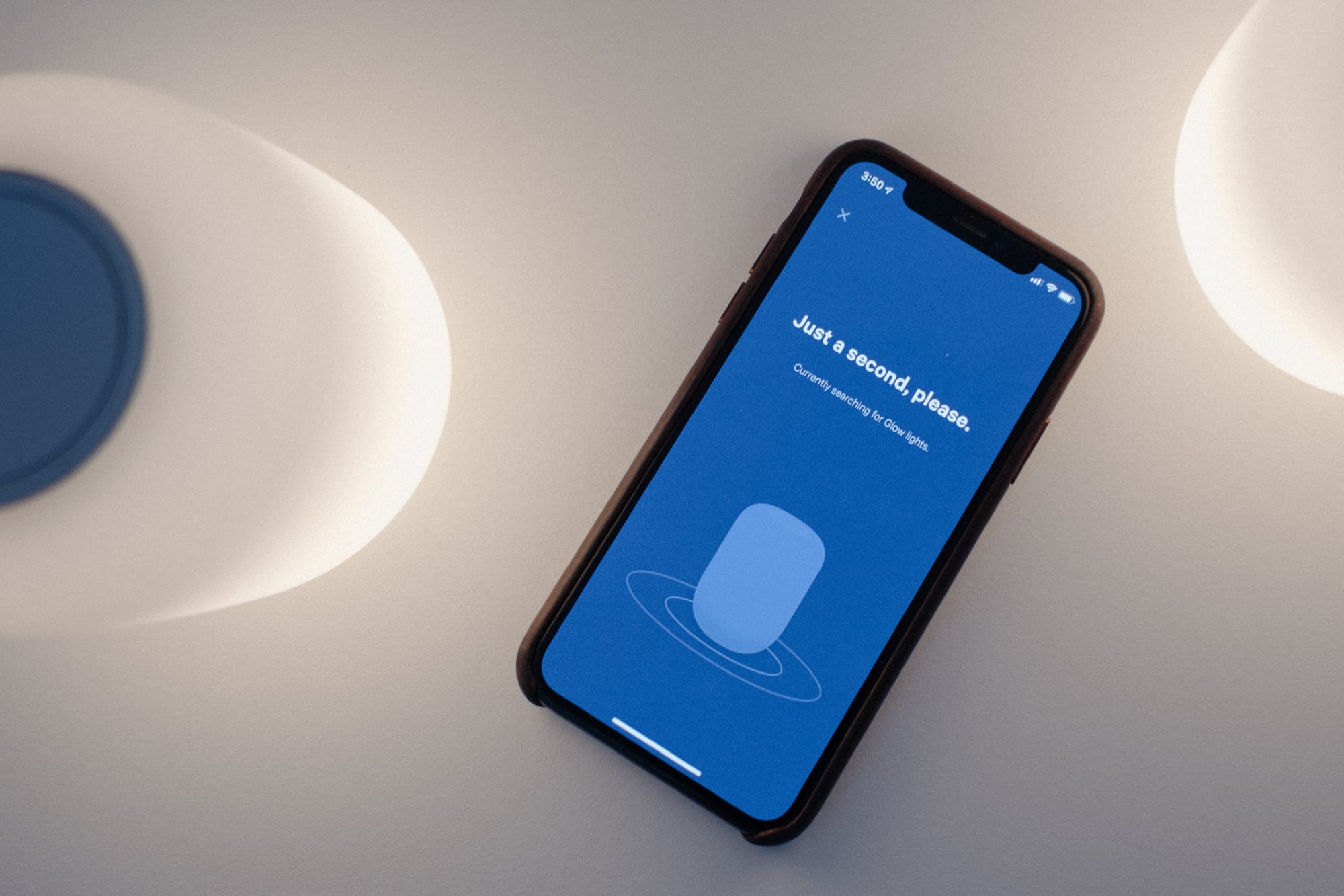 caspper app on table beside lights showing user interface
