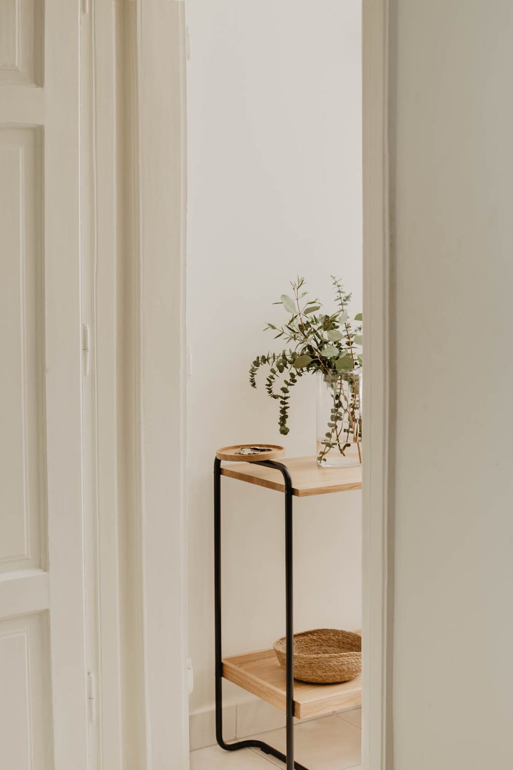 Shelf with vase and keys visible on top