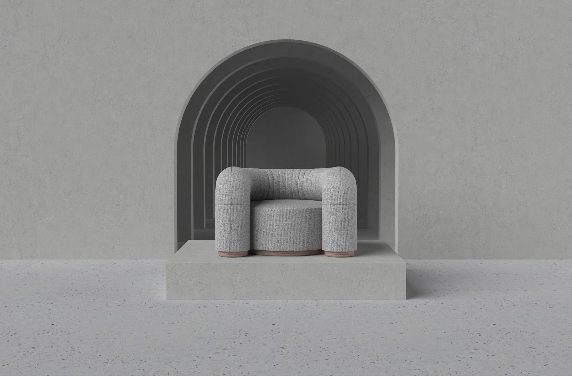soft round chair in grey sitting on a pedestal
