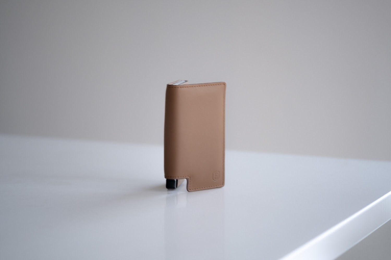 Ekster Wallet standing up on a white counter