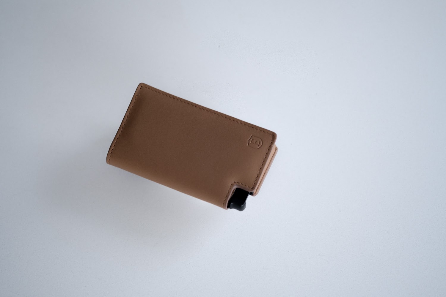 Ekster Wallet floating on white counter