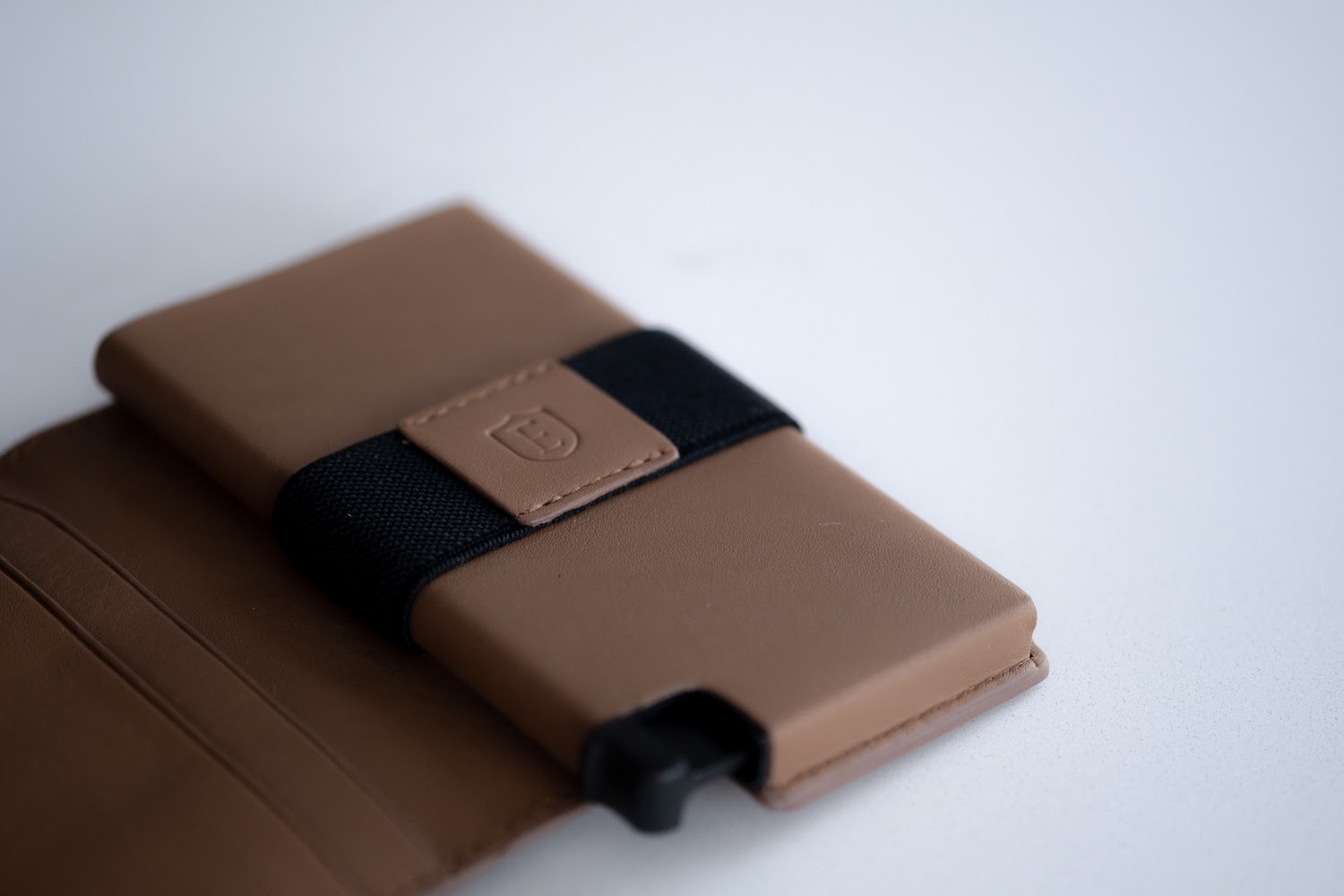 Close up of ekster wallet logo