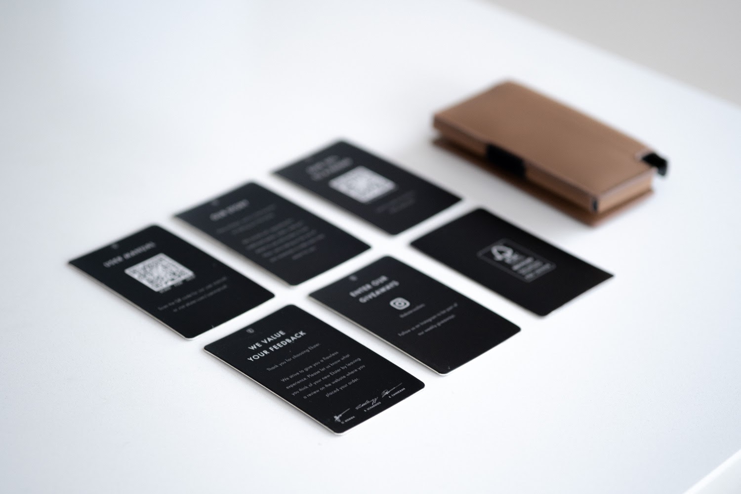 Card packaging laid out on table 