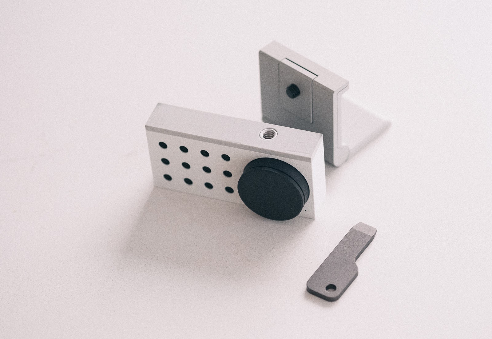 bottom of opal c1 web camera with mount and screwdriver