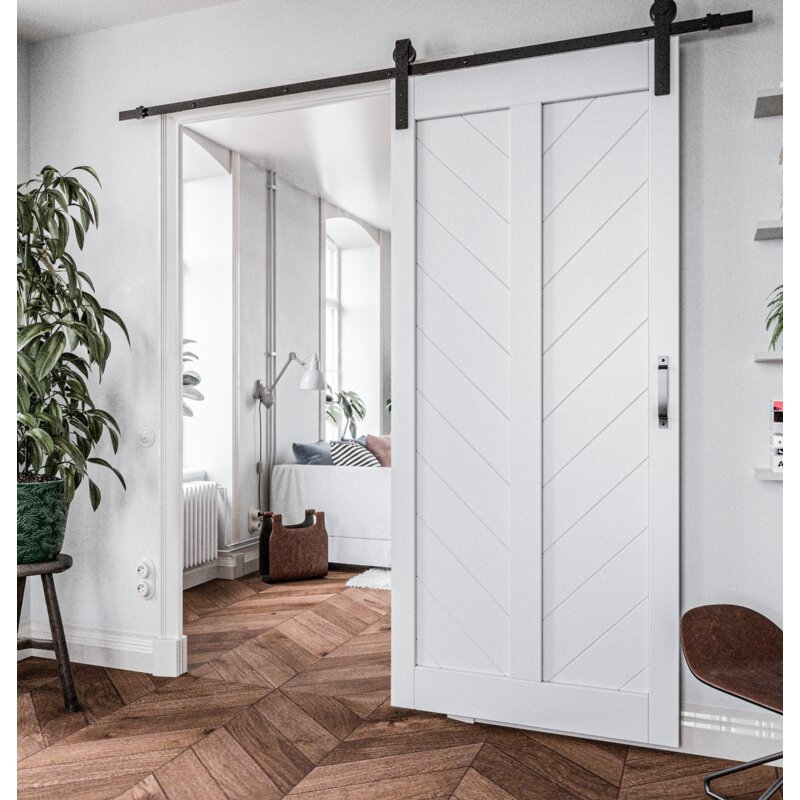 Open white wooden door hanging from a black rail.