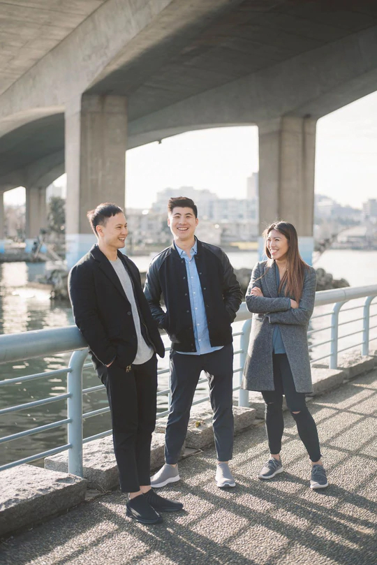 vessi founders standing under a bridge