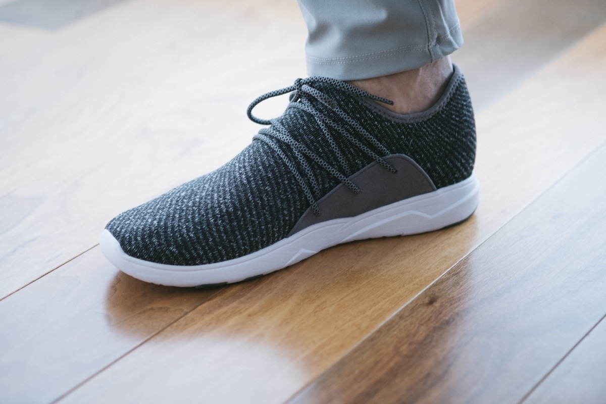 Closeup of vessi shoe on hardwood floor