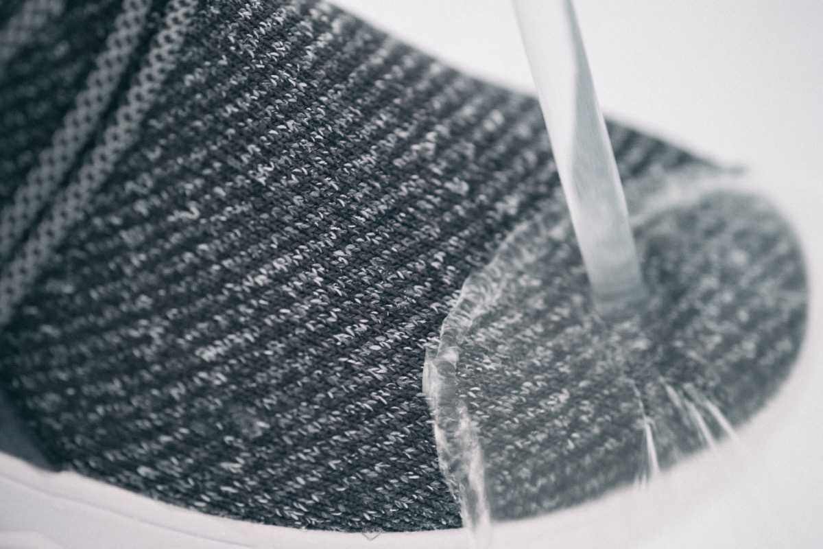 Closeup of vessi shoe being held underwater