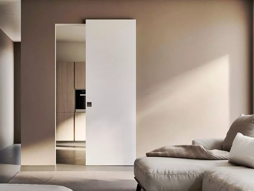 white sliding door open with simple recessed square handle