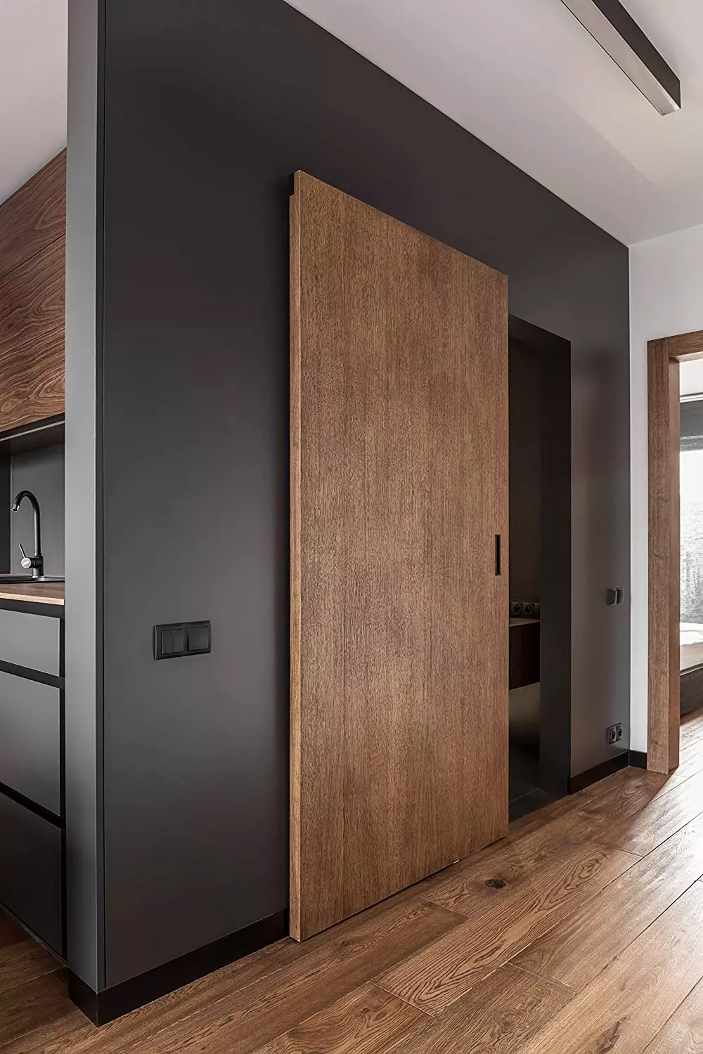 Simple wooden door with no visible sliding hardware