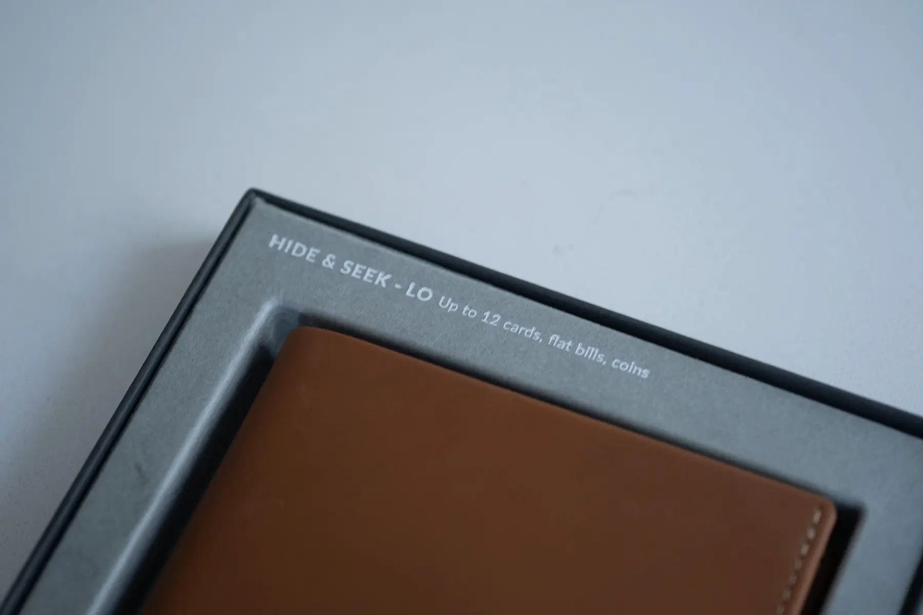Belloy wallet in packaging showing features