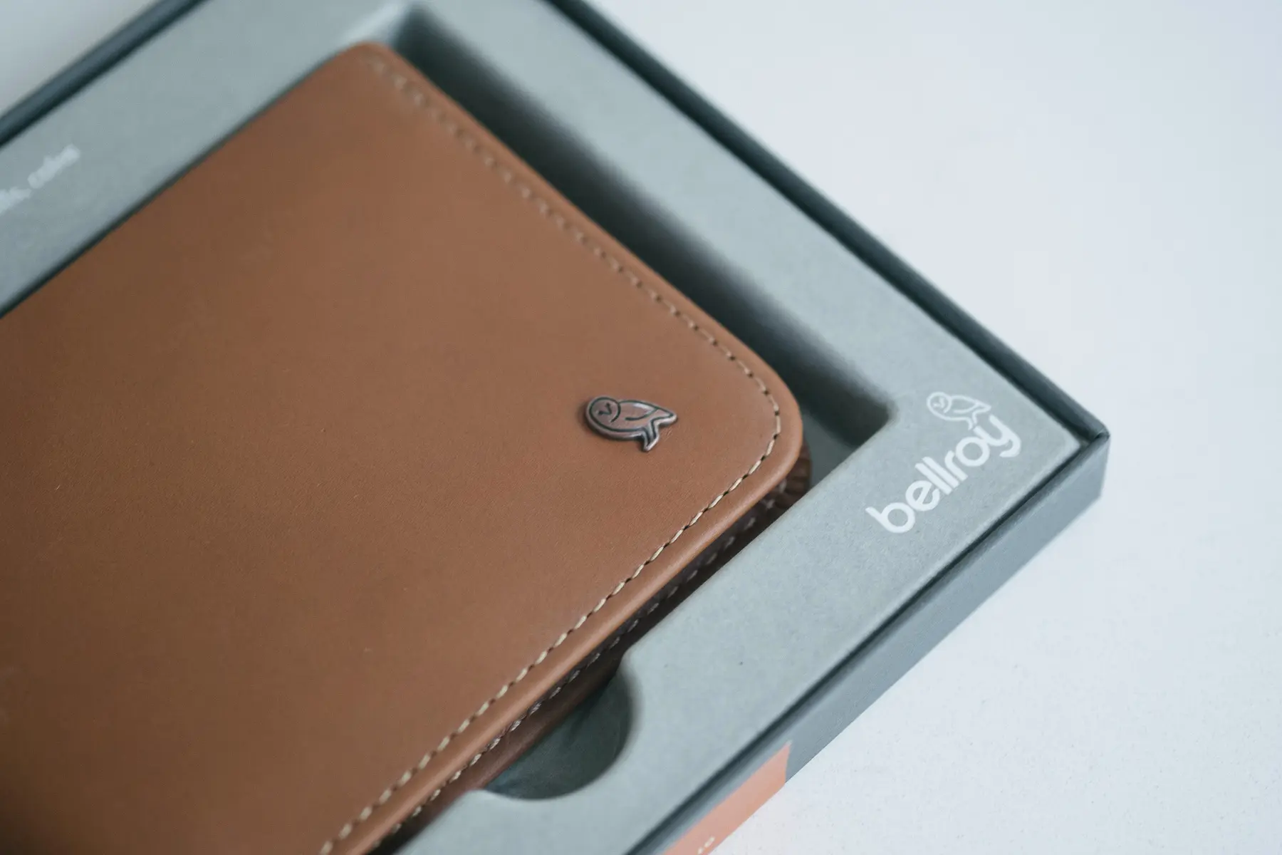 Close up shot of a Bellroy wallet showing an owl logo