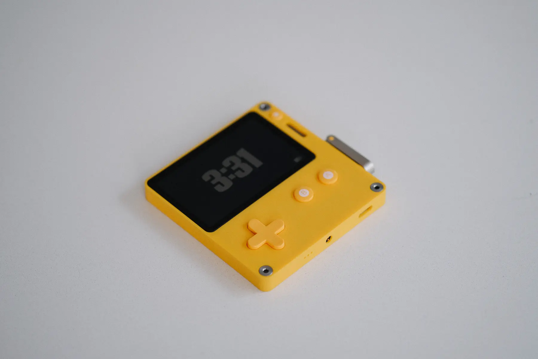 playdate console on a white table