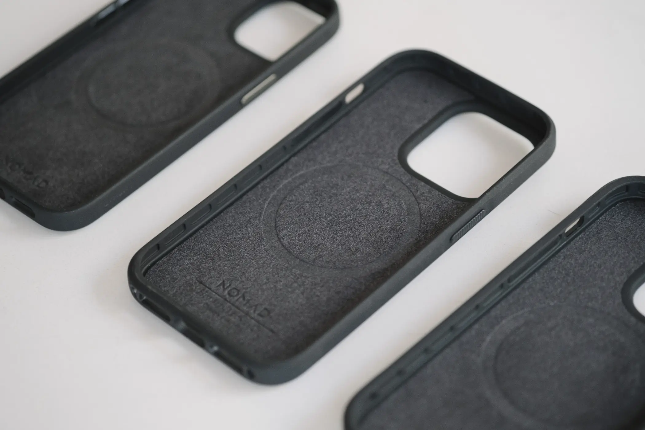 Inside of three phone cases showing soft material