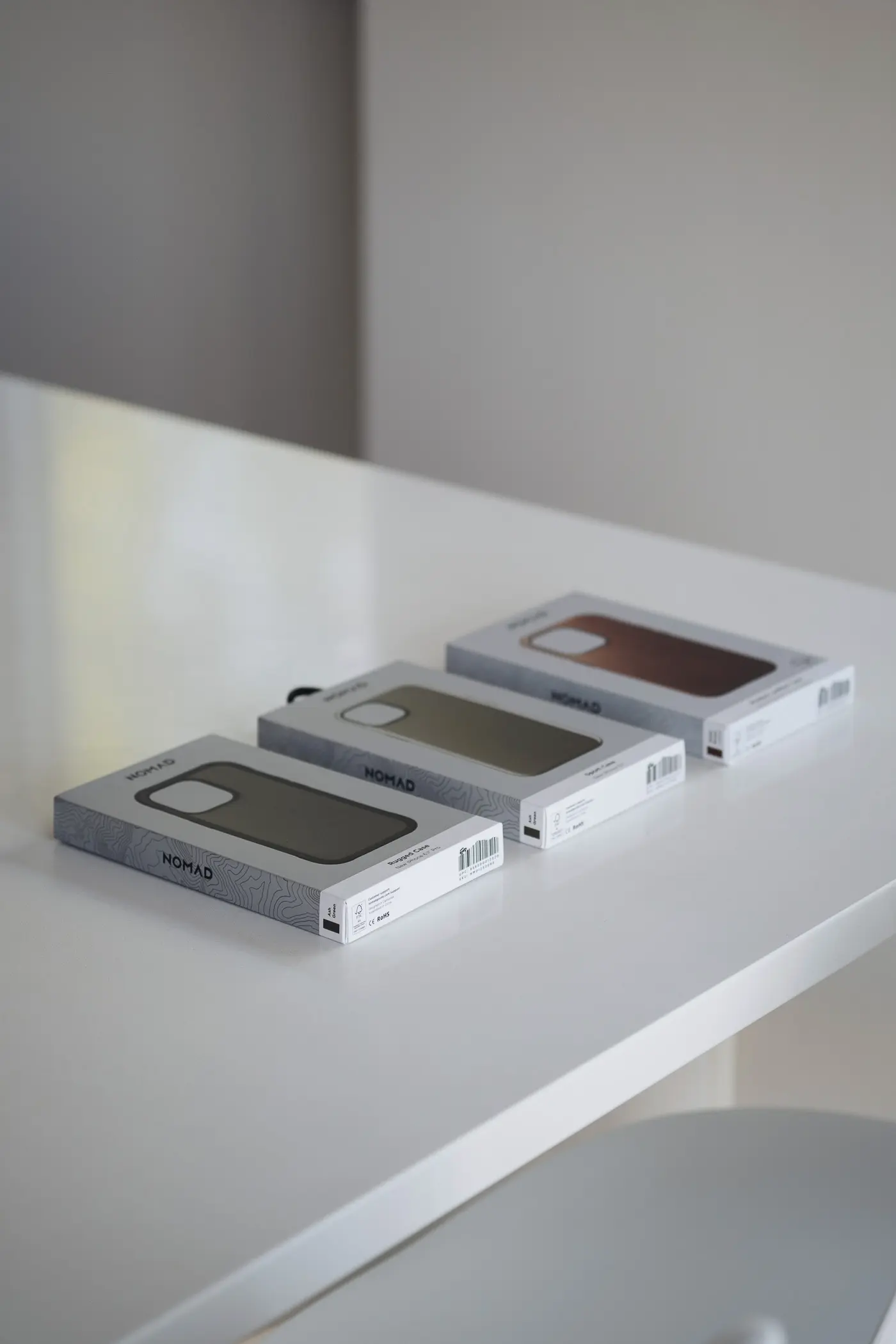 Nomad iphone cases on a white table
