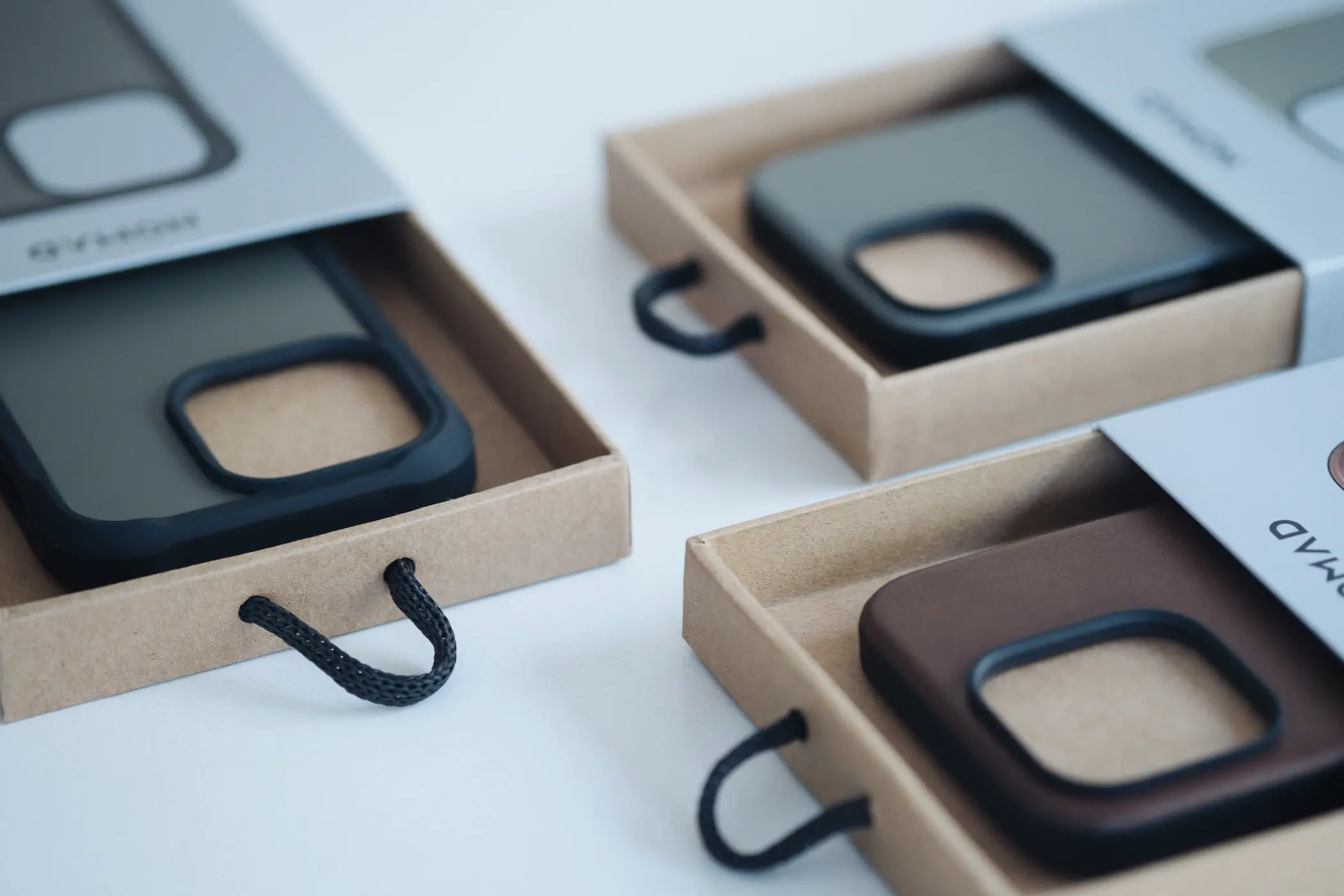Nomad iphone cases with the boxes open slightly