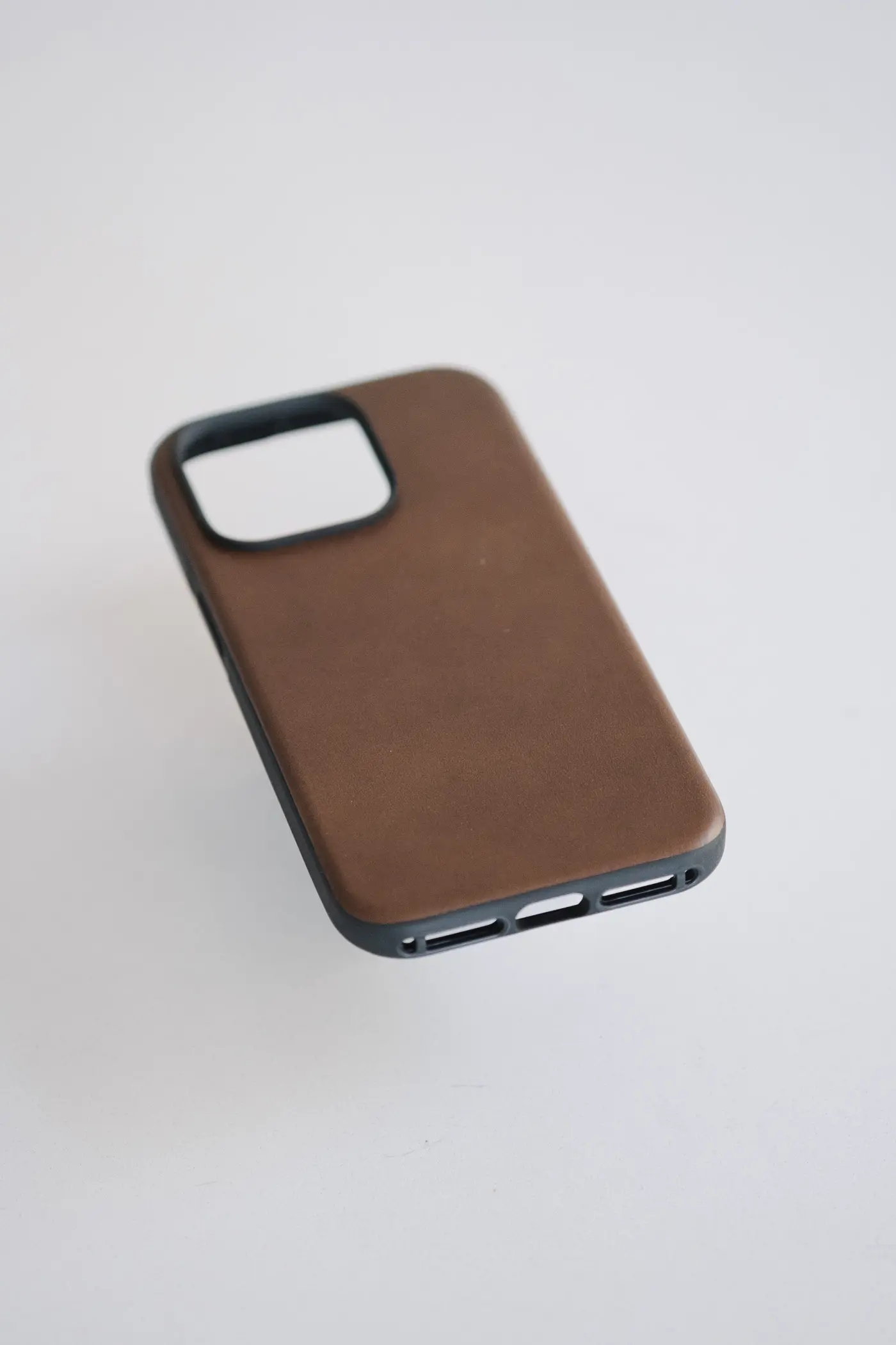 back of leather case showing material on a white table
