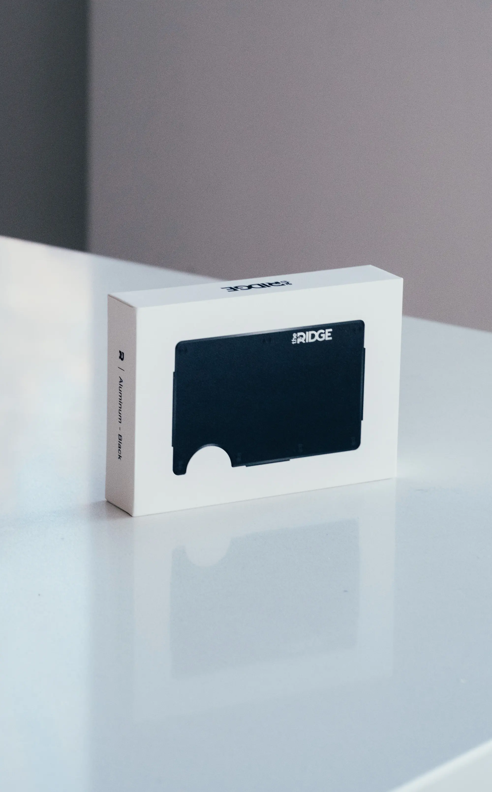 ridge wallet in box sitting on a white counter