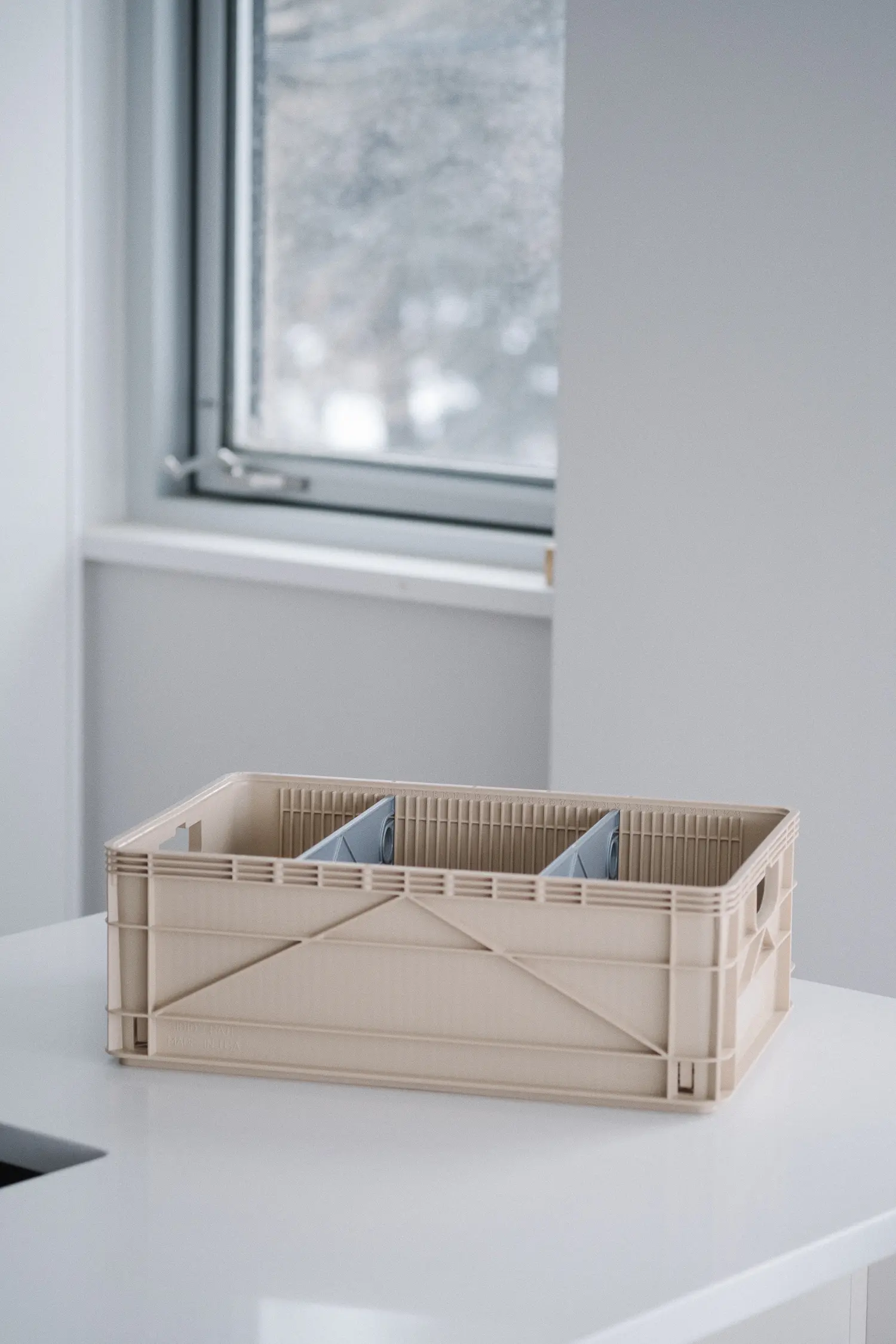 tan colored crate on white countertop