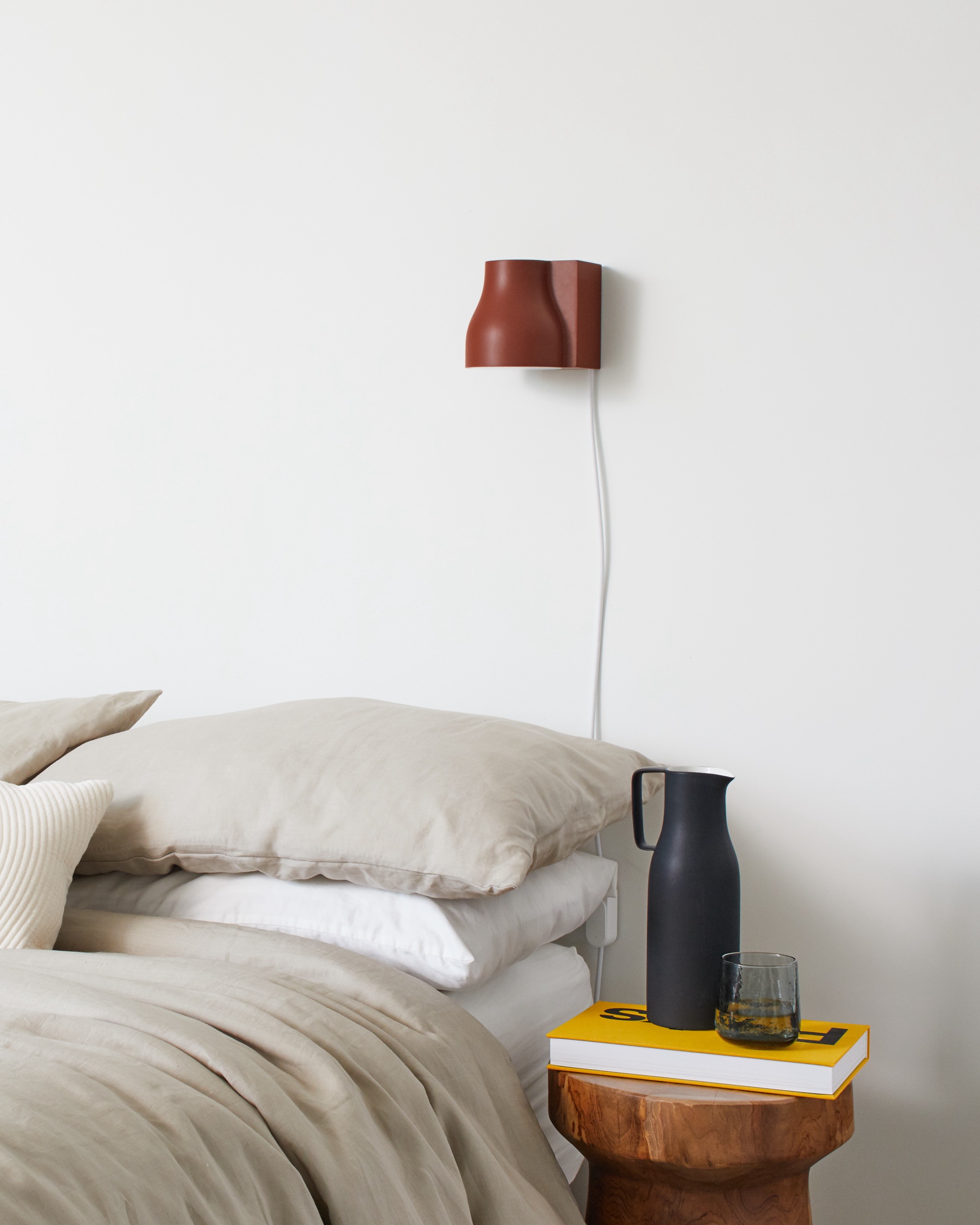 Wall mounted light above bed