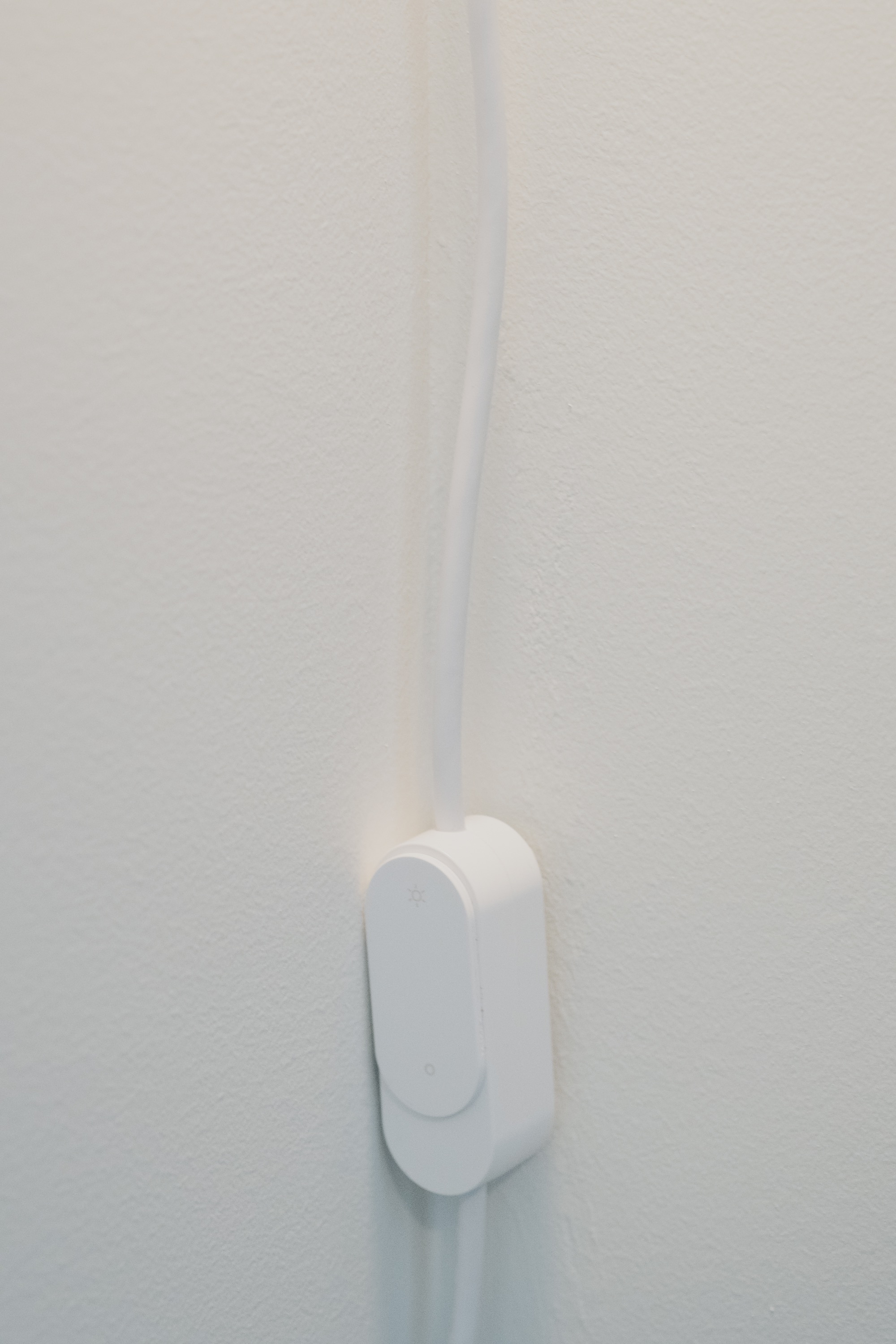 White dimmer switch on cord
