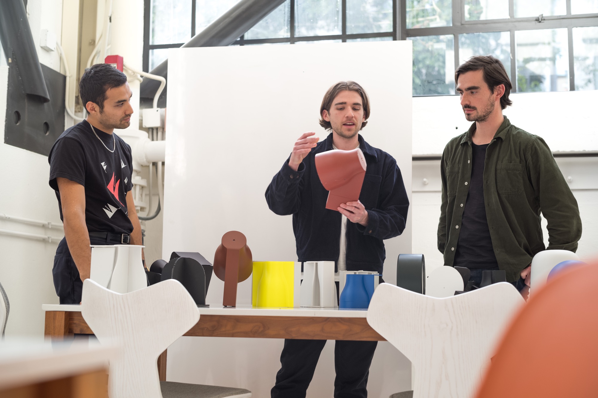 Design team reviewing prototypes