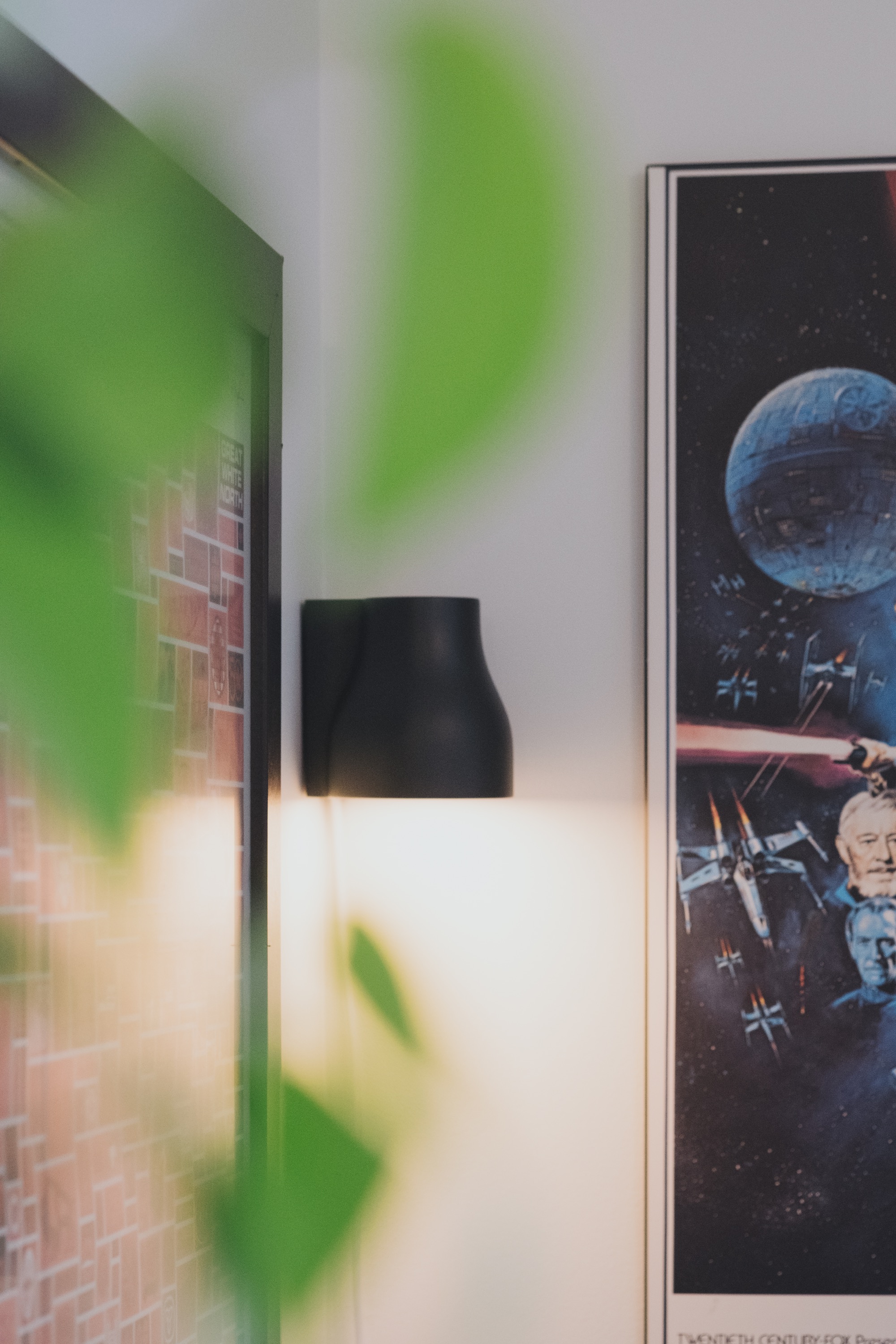 Light in corner of room with posters